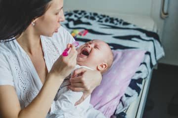 How to give syrup to baby who refuses?