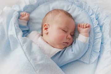 How should a newborn sleep?