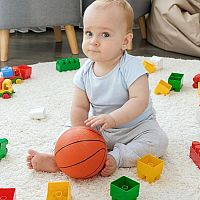 9-month-old baby with toys